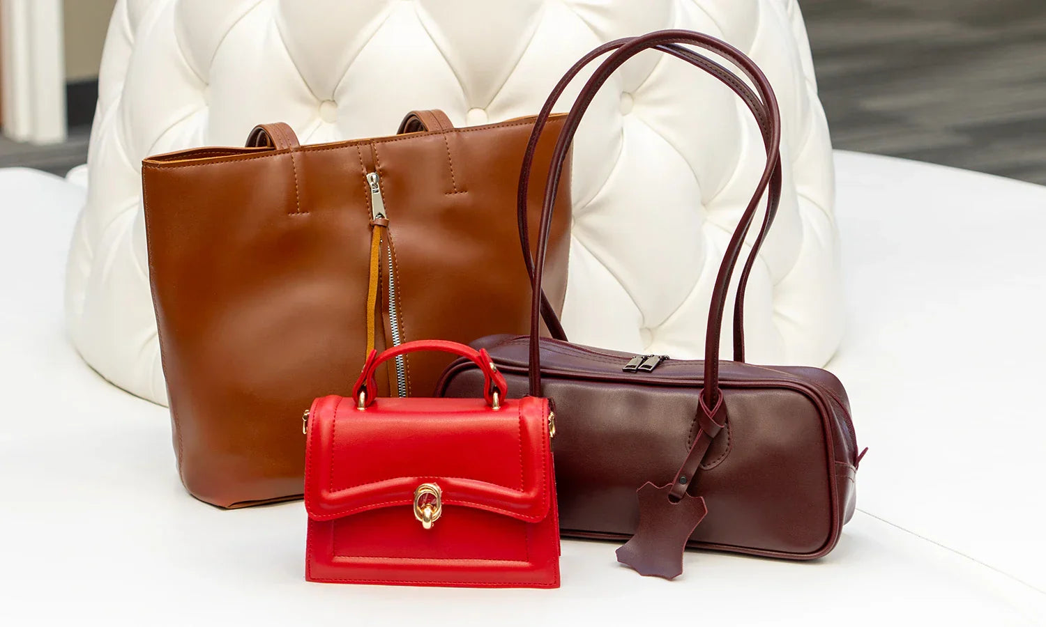 Handmade vegan leather shoulder bags for women in brown, burgundy, and red